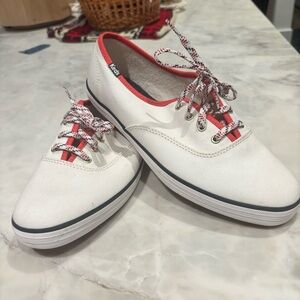 Keds White Canvas Sneakers with red and blue accents and laces.